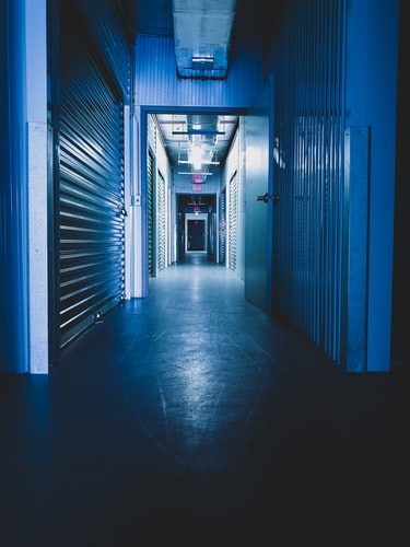 A darkened storage facility hallway