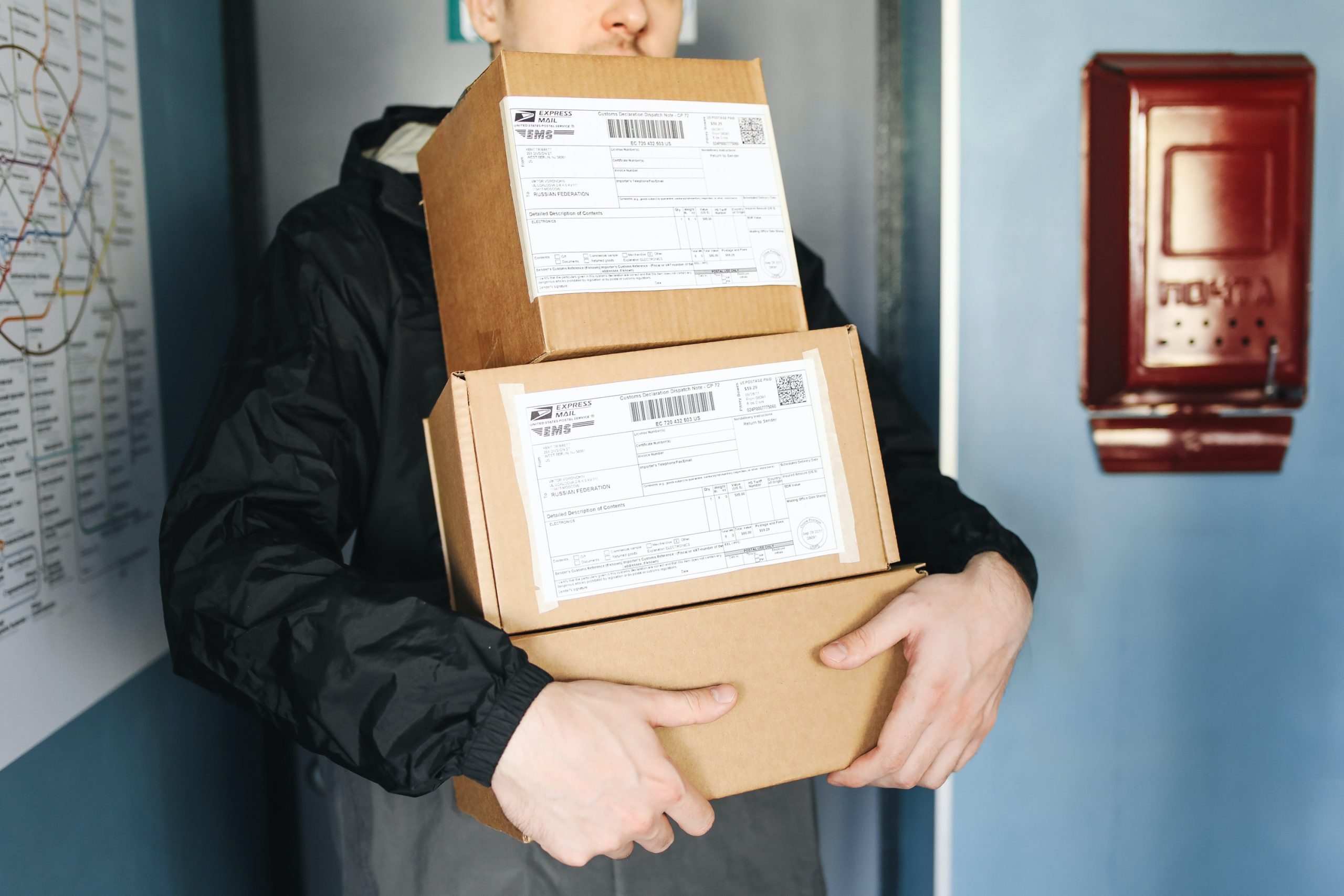A man holding a few boxes