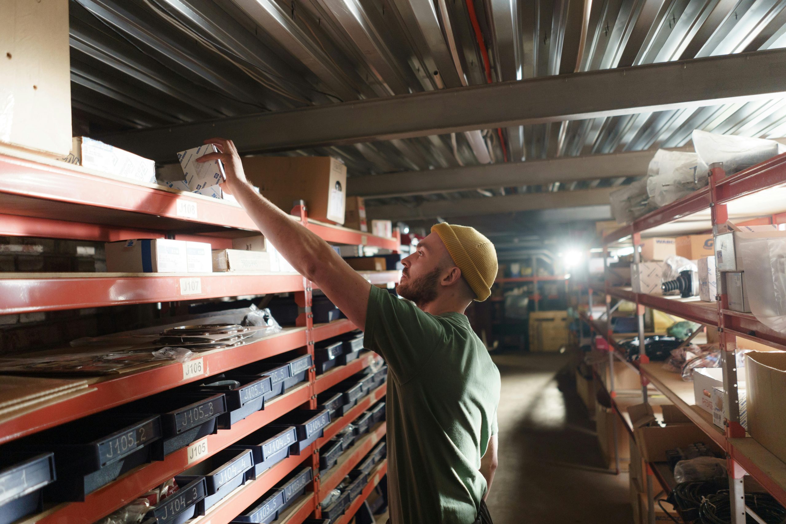 man sorting inventory for his small business