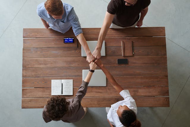 A group of four people agreeing to share a storage unit